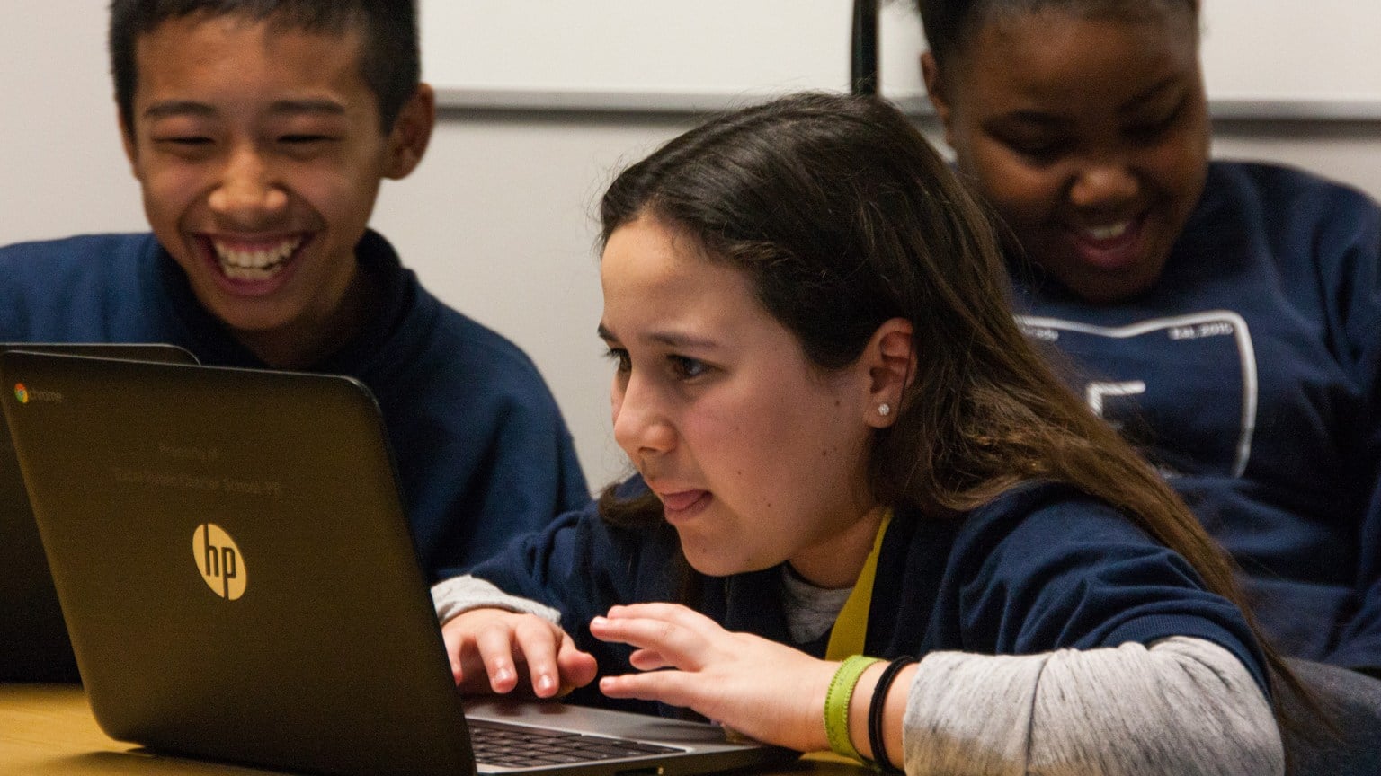 Photo of students working on laptops